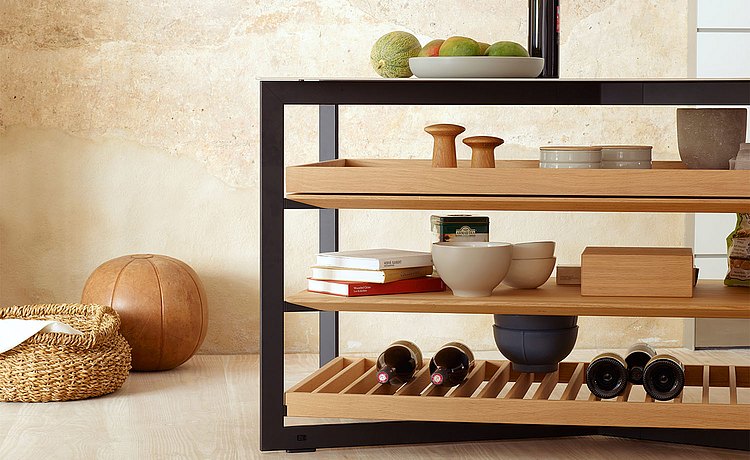 Shelf options in the b Solitaire stainless steel: wooden grid for bottles, wood top for books, and the wooden pull-out for storage  